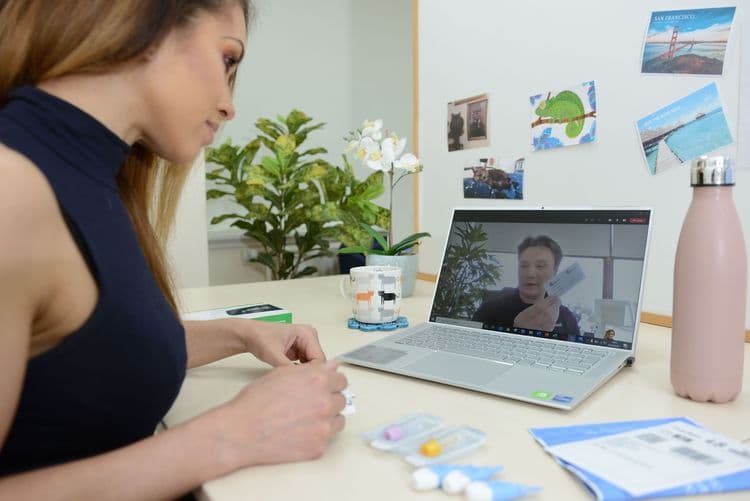 Woman in a virtual meeting on her laptop.