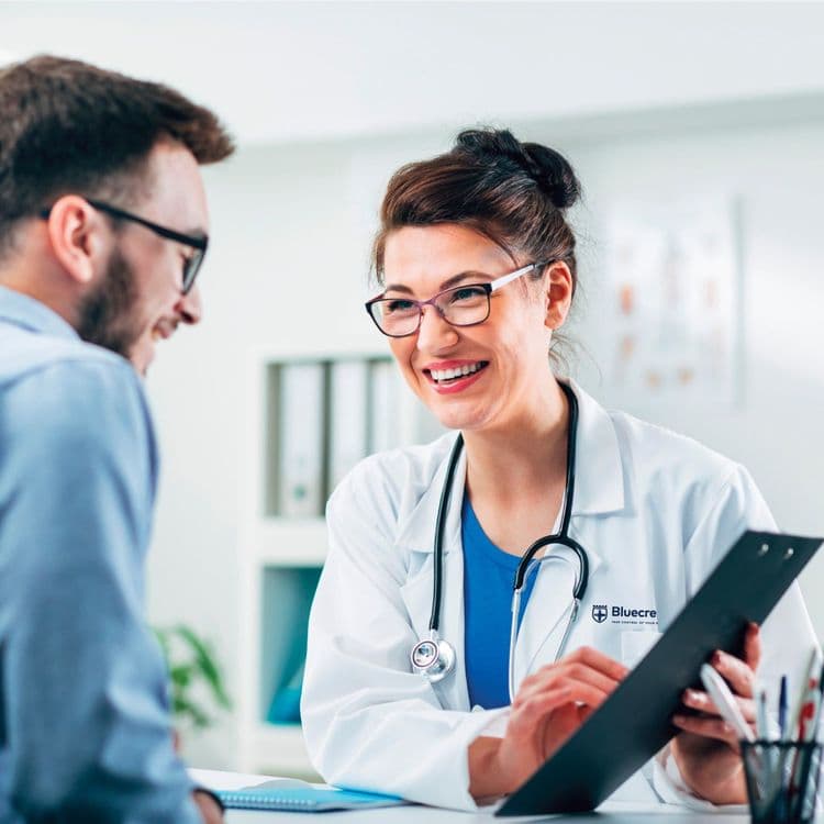 A Health Assessment Specialist explaining the Bluecrest Wellness health check process