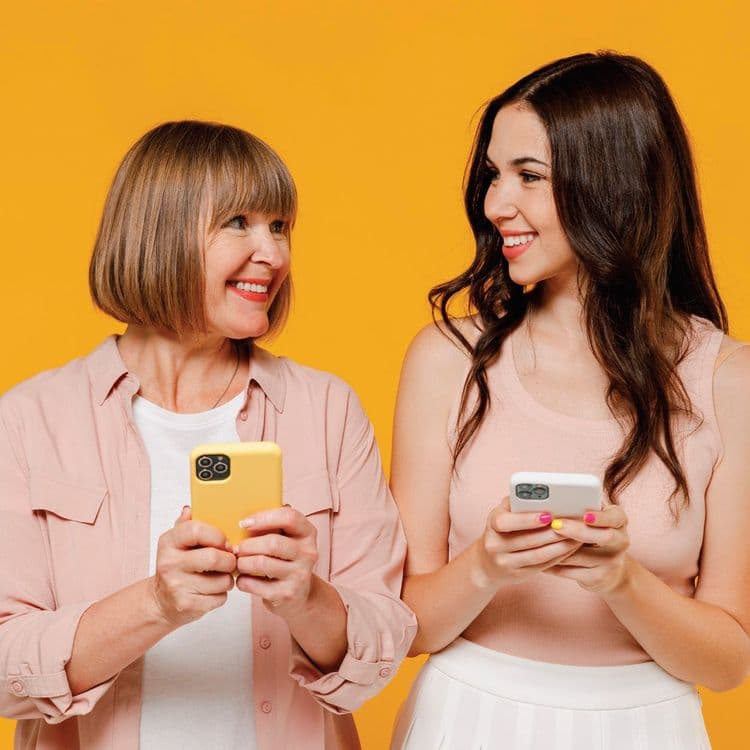 Mother and Daughter checking their Bluecrest Health Check results on their phones